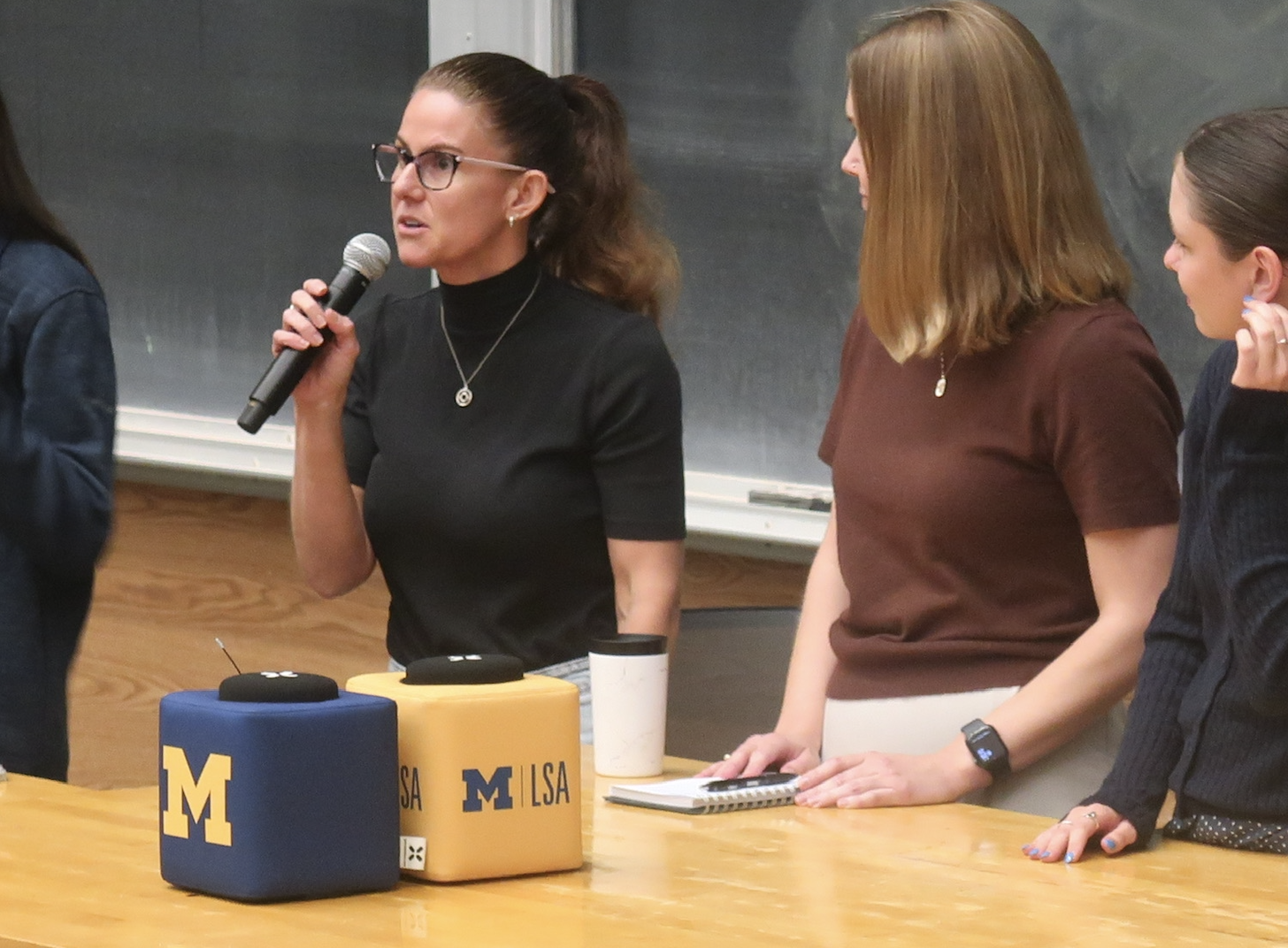 Speakers on a debate panel