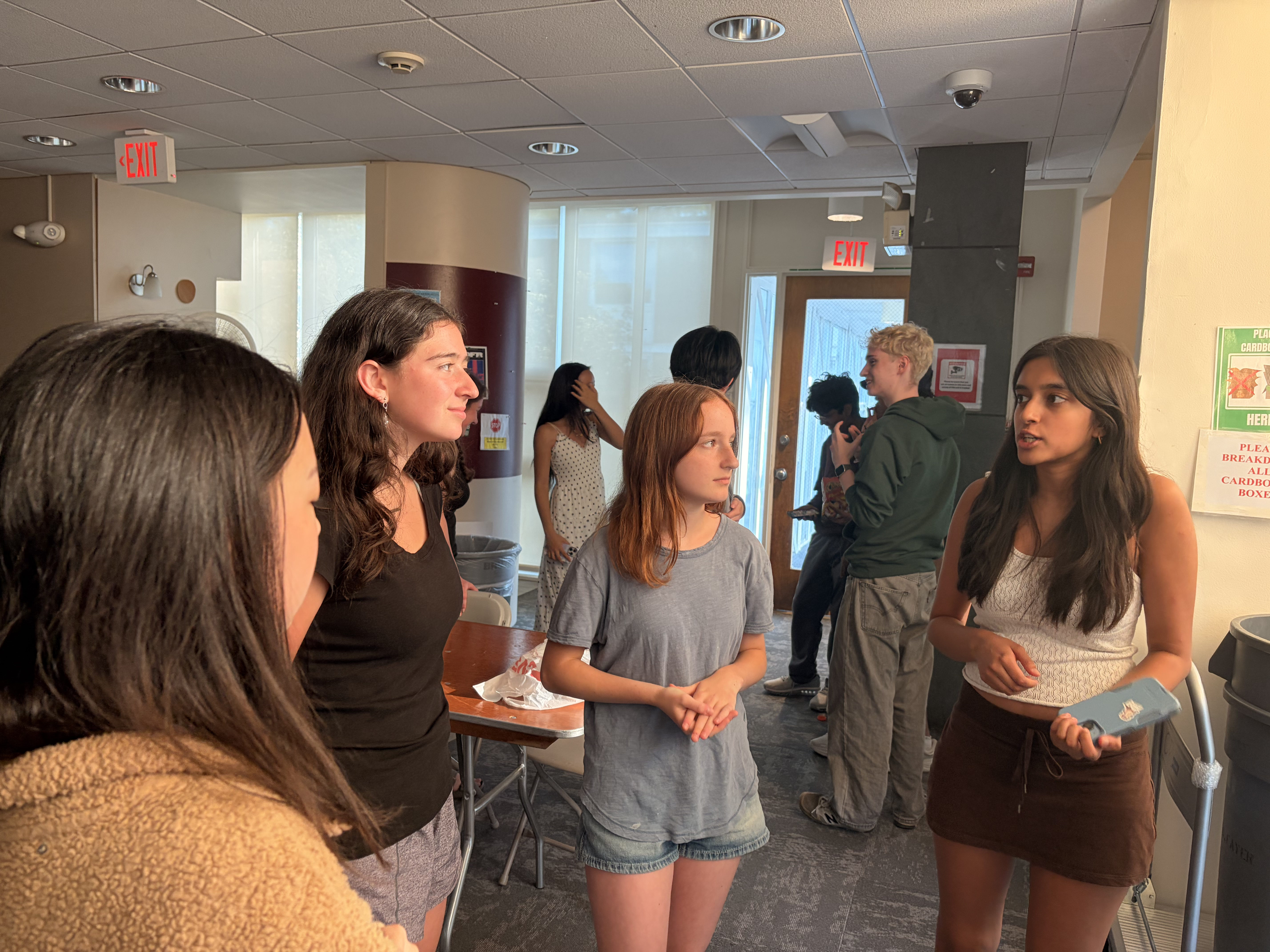 Debaters talking together between sessions