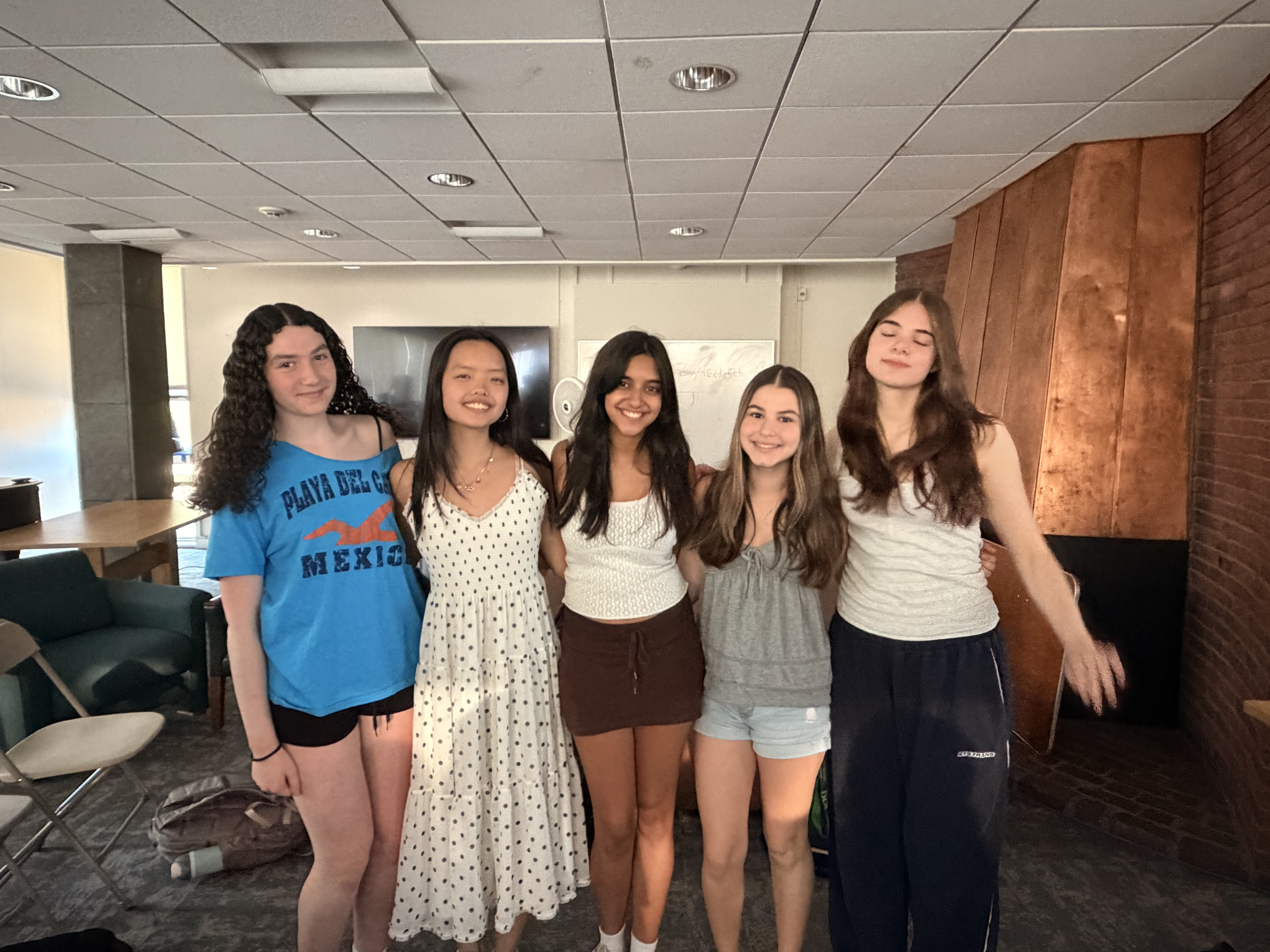 Friends standing together at camp